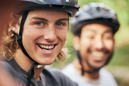 Smile, portrait and a man with a cycling selfie in nature for fitness, travel or adventure memory. Happy, friends and a cyclist taking a photo in a forest for marathon, triathlon or sports trainingの写真素材