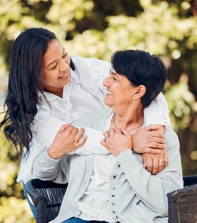 Woman, mature mother and hug in garden with love on mothers day or women bonding with care for mom...
