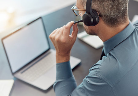 Businessman, laptop mockup and call center with headphones in customer service or telemarketing at...