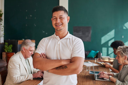 Smile, portrait and a man in a meeting with arms crossed for coworking and business pride. Happy, office and a mature businessman with confidence in professional team and career in the workplaceの写真素材