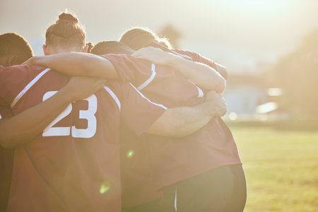 People, rugby and huddle in team sports, motivation or getting ready for match or game on outdoor field. Active men in circle or group hug in teamwork, collaboration or trust in scrum for fitnessの写真素材