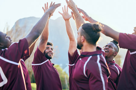 Raised hands, sports and excited people, rugby team building and solidarity support, teamwork or cooperation. Motivation, group celebration cheers and excited player smile for athlete challengeの写真素材