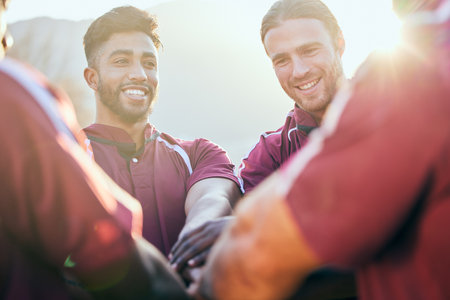 Hands together, sports and happy people huddle, rugby team building and solidarity support, teamwork or cooperation. Mission goals, group celebration and excited player smile for athlete challengeの写真素材