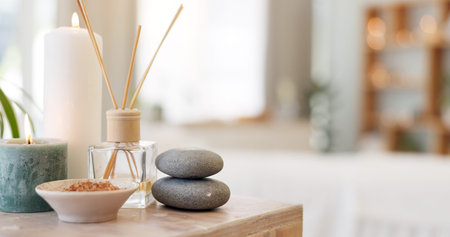 Spa, rock and candle to relax in a room with atmosphere, mood or ambience in a health club....