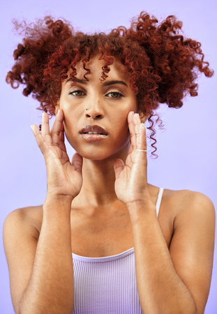 Woman, hair and beauty with hands on face in a studio, red curls and dermatology with makeup...