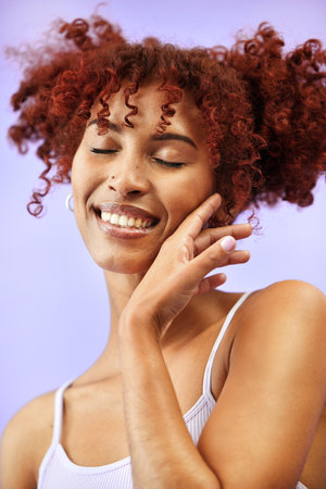 Beauty studio, eyes closed and happy woman feel cosmetics results, facial aesthetic transformation and collagen. Spa skincare shine, foundation makeup and dermatology model smile on purple backgroundの写真素材