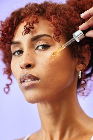 Skincare, portrait and woman with face serum in a studio for natural, beauty and cosmetic routine....