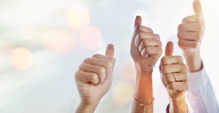 Mockup, success or hands of business people with thumbs up for approval on sky background. Teamwork, community or closeup of employees with solidarity or group support for growth, like or okay signの写真素材