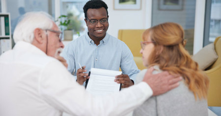 Senior couple, explanation and contract with financial advisor and retirement plan to sign. Document, pension talk and business analyst with information and paperwork in office for signature of willの写真素材