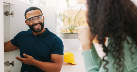 Plumbing, handyman and maintenance with man smiling and sink with customer for improvement, contractor and fixing. Home renovation, service and inspection with plumber and woman for industry, labor oの写真素材