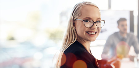 Portrait, business and woman with glasses, smile or professional with confidence, banner or bokeh. Face, happy person or consultant in a workplace, overlay or employee with success, career or meetingの写真素材
