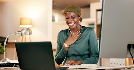 Winning, yes and happy woman on laptop in night news, international success or Nigeria business celebration accomplishment. African person or winner for stock market, trading or career bonus on compuの写真素材