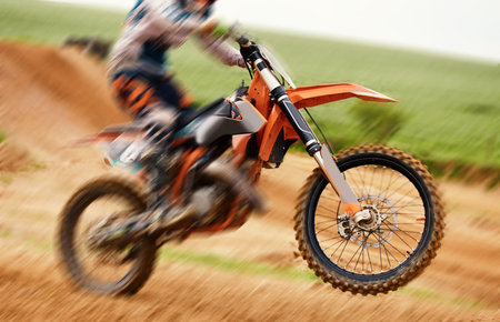 Bike, balance and motion blur with a sports man on space outdoor for dirt biking closeup....