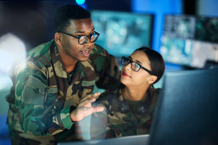 Night training, army and people with a computer for communication, planning strategy or...