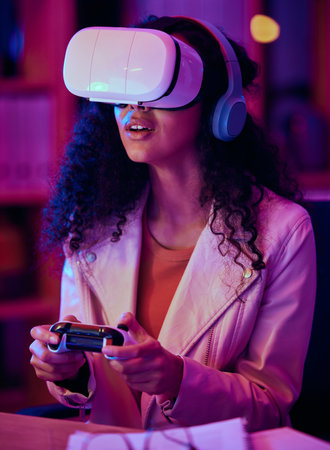 VR, glasses and woman, gaming developer and programmer test game software, futuristic technology and neon light in office. Information technology professional or gamer with virtual reality at nightの写真素材