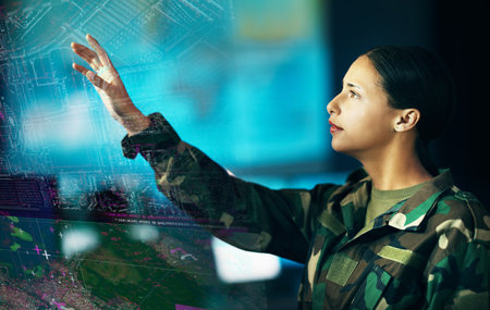 Map, location and a military woman using a dashboard for security, strategy or surveillance in a control room. Army, digital and double exposure with a young soldier looking at a 3D or AI hologramの写真素材