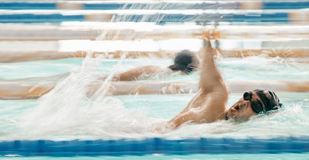 Fitness, water and a swimmer in a pool during a race, competition or cardio training at a gym....