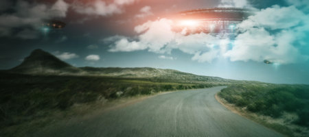 Road, UFO and spaceship with blue sky, innovation and planet with travel, alien and transport with science fiction. Craft, technology and trees with light beam, universe and galaxy mission with glowの写真素材