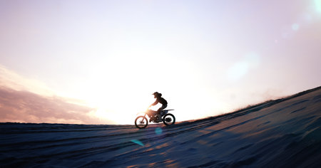Motorcycle, person and driving for training or sports with fitness, balance or challenge in nature on mock up space and sky. Bike, freedom and adventure for competition, exercise or talent in desertの写真素材