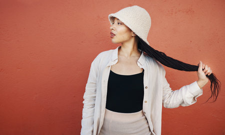 Fashion, hair and black woman in city with trendy outfit, cool clothes and style for glamour....