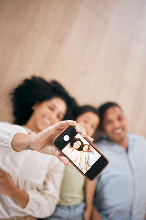 Phone, selfie and happy family in home, top view and bonding together. Smartphone screen,...