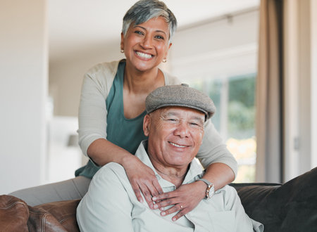Senior couple, portrait and smile in home for retirement, marriage commitment and loyalty to...