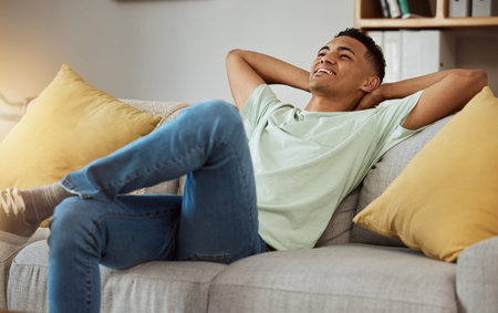 Relax, calm and man in a sofa happy, chilling and enjoy weekend freedom at home. Resting, peace and...