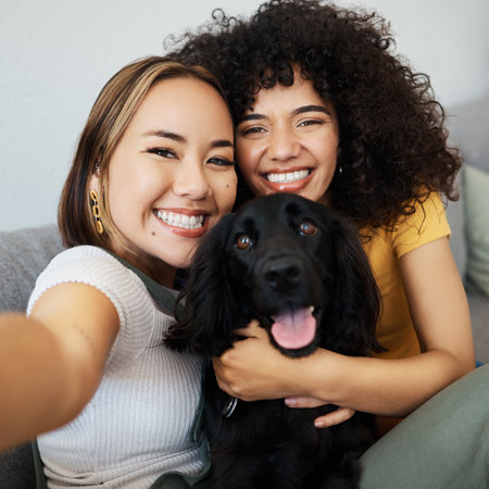 Dog, portrait or lesbian couple in selfie in home to relax together on social media for profile picture or memory. Lgbtq, pet animal or happy women smile in photo with bond or care in living roomの写真素材