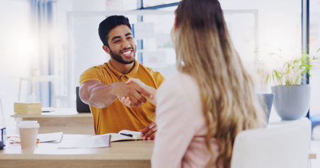 Smile, business people and handshake for partnership, deal or introduction in workplace. Happy, man...