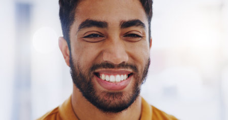 Face, smile and business man in office with pride for career, job or occupation. Portrait, professional and happy, confident and proud male entrepreneur from India with success mindset in workplace.の写真素材