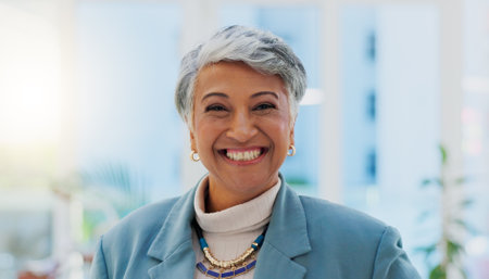 Face, happy and senior business woman, CEO or executive director smile for startup company success, growth or development. Portrait, happiness and professional person, boss or manager of design firmの写真素材
