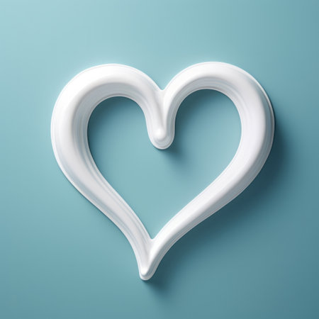 White toothpaste in heart shape on blue copyspace background. Healthy teeth conceptの素材