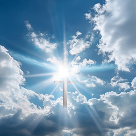 Christian cross seen in cloudy sky with sun. Religion concept.の素材