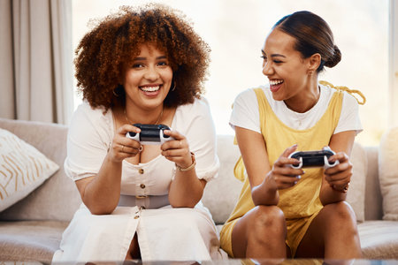 Portrait of women on sofa playing video game, excited fun and relax in home living room together on...