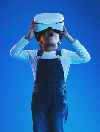 Wow, girl and kid with virtual reality glasses, futuristic and metaverse on a blue studio...