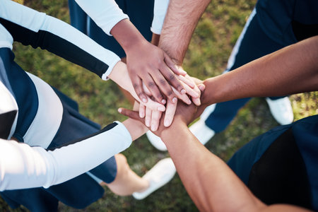 Hands, together and people in sports huddle for support and solidarity in athlete team with top view. Fitness group outdoor, collaboration and trust, mission in partnership synergy and game planの写真素材