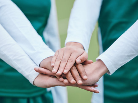 Stack, sports or hands of team in huddle with support, solidarity or plan for a hockey training game. Group, turf closeup or athletes in practice for fitness exercise or match together for teamworkの写真素材