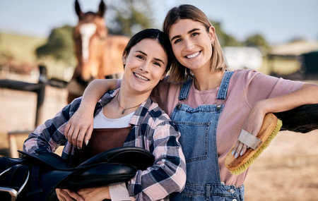 Horse, friends and portrait of women with saddle and brush for animal care, farm pet on ranch. Farming, countryside and happy people hug with stallion for bonding, relax and adventure outdoorsの写真素材