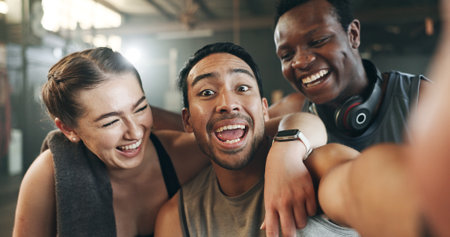 Happy people, friends and selfie in fitness, photography or memory together after workout at gym. Portrait of group smile in happiness for photograph, picture or social media at indoor health clubの写真素材