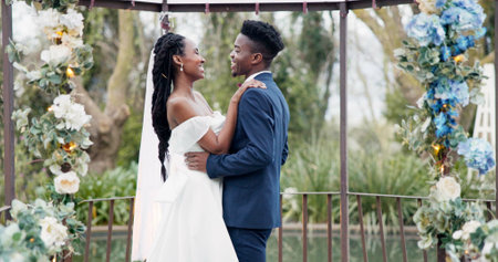 Wedding, dance and black couple in garden with love, celebration and excited future together. Gazebo, man and woman at luxury marriage reception with flowers, music and happiness at party in nature.の写真素材