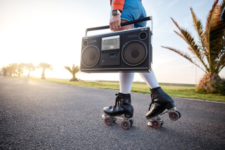 Woman, retro radio and outdoor with roller skates, music and training with freedom, road and summer....