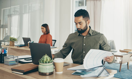 Business man, paperwork and laptop for taxes, finance report and company revenue or budget planning...