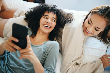 Home, lesbian couple and women with a phone, digital app and typing with social media, relax and...