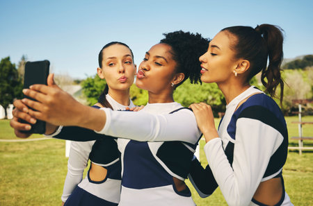 Field, women or cheerleaders in team selfie at a game with support in sports training, exercise or...