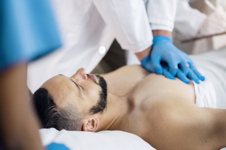 CPR, emergency and hands doctor with man in hospital for medical service, first aid and surgery....
