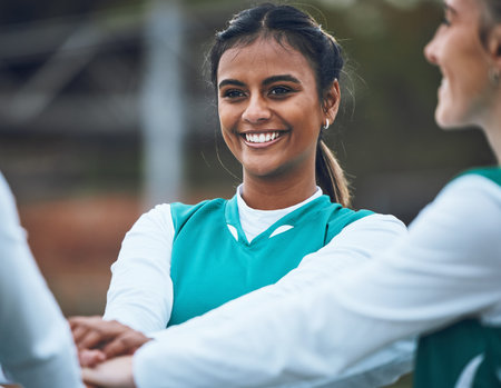 Teenager, girl and smile for sports with team with hands together for game. Female, student and...