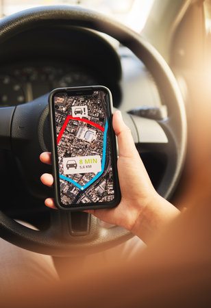 Phone, map and hands of person in a car for location, search or navigation closeup. Smartphone, travel and driver check app for online traffic notification, direction or road trip route in a vehicleの写真素材