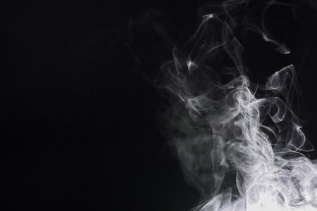 Smoke, dark background and incense, fog or gas on mockup space wallpaper. Cloud, smog and magic effect on black backdrop of steam with abstract texture, dry ice pattern or vapor of mist moving in airの写真素材