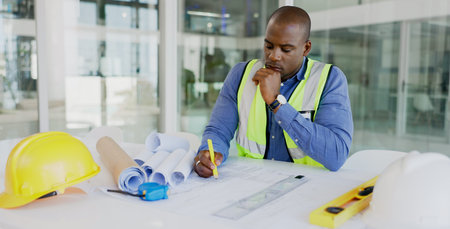 Black man, architect and thinking while drawing blueprint for construction job, engineering and...
