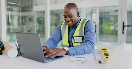 Laptop, smile and a black man construction worker in an office for planning a building project....